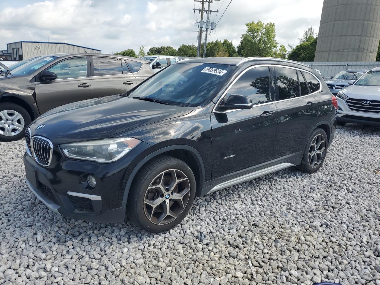 BMW X1 XDRIVE2 2017 black 4dr spor gas WBXHT3C31H5F82650 photo #1