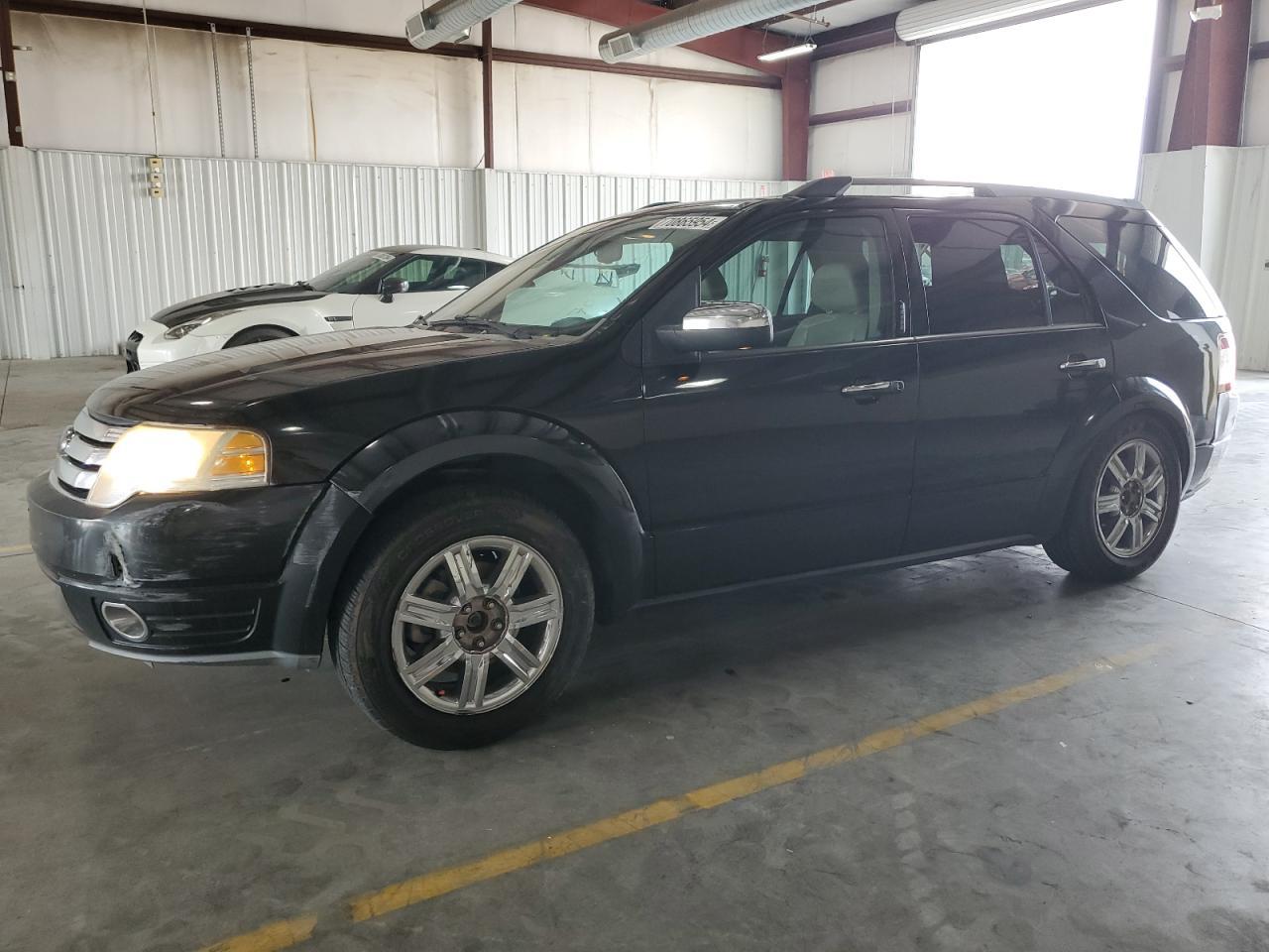 FORD TAURUS X L 2009 black 4dr spor gas 1FMDK06W99GA02255 photo #1