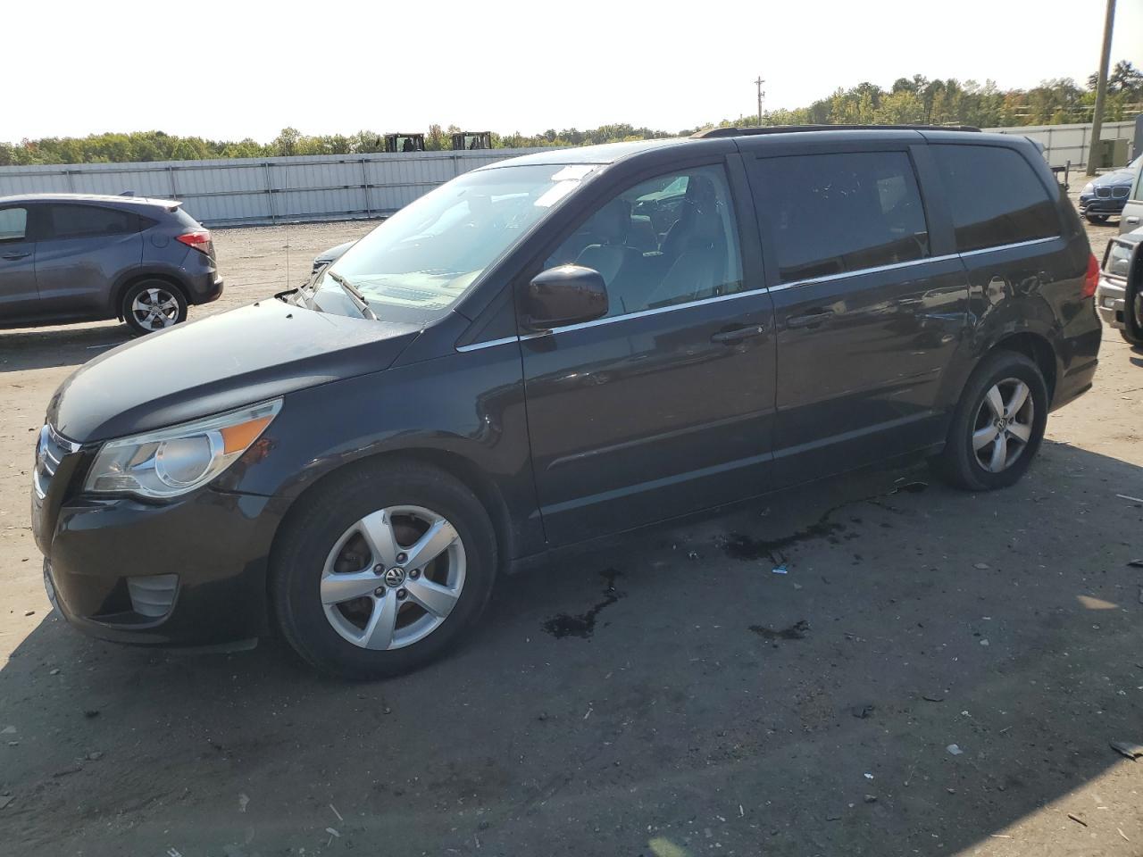 VOLKSWAGEN ROUTAN SEL 2011 black sports v flexible fuel 2V4RW5DGXBR670518 photo #1