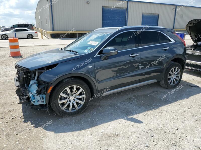 CADILLAC XT4 PREMIU 2021 green  gas 1GYFZCR44MF080102 photo #1